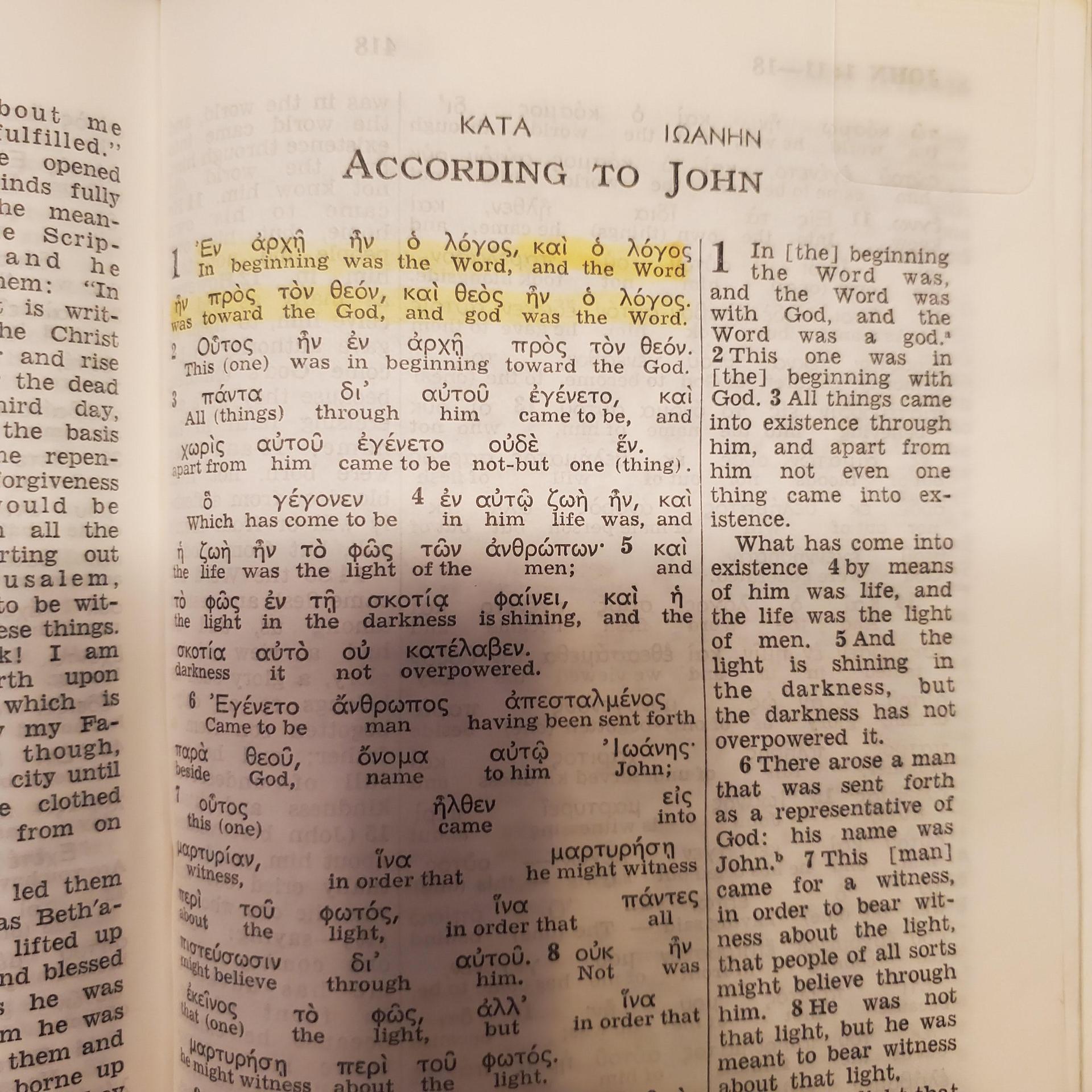 Kingdom Interlinear Translation showing John 1:1 - 'god was the Word' in interlinear vs 'a god' in NWT